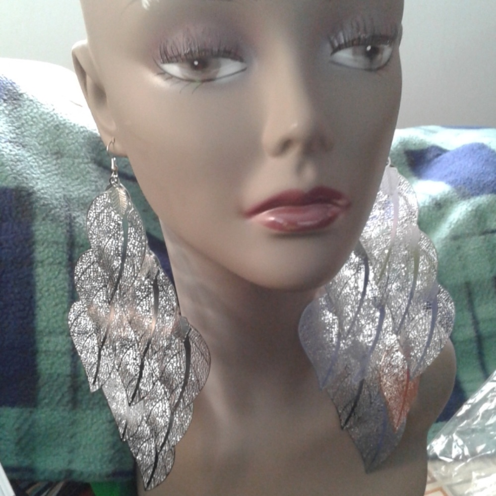 NWT.  Long layered leaf pattern earrings